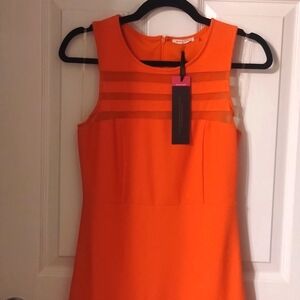 This is an XS orange knee length dress by Main Strip